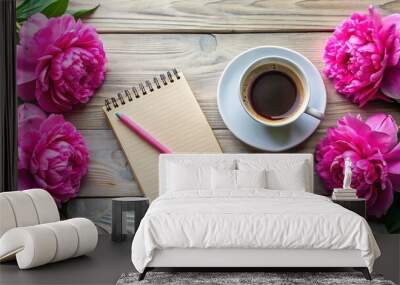 Morning coffee mug and pink peony flowers on a white stone table with an empty notebook and pencil Wall mural