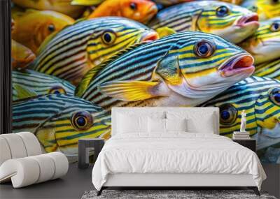 Vibrant Indian Ocean Oriental Sweetlips on display at the seafood market, its scales shimmering in red and orange hues. Wall mural