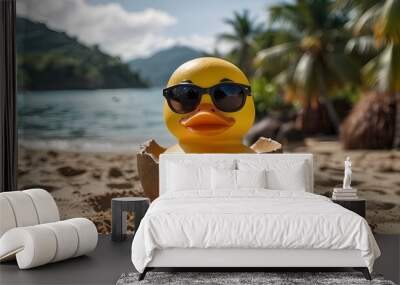 Rubber duck with black sunglasses at the beach with blue sunny sky. Wall mural