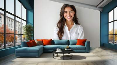 Cheerful brunette business woman student in white button up shirt, smiling confident and cheerful with arms folded, isolated on a white background Wall mural