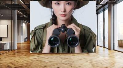 Wildlife Conservationist's Attire: Full face no crop of a Pretty Young Chinese Super Model in Safari Outfit and Binoculars, emanating environmental passion with a determined gaze Wall mural