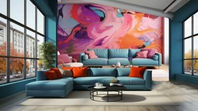 Abstract painting on the wall in bright colors. The blue sofa complements the interior of the room. Wall mural