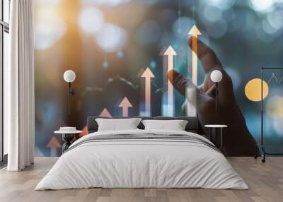 Hand pointing at upward arrow graph, symbolizing growth, success, and positive trends in business or finance. Wall mural