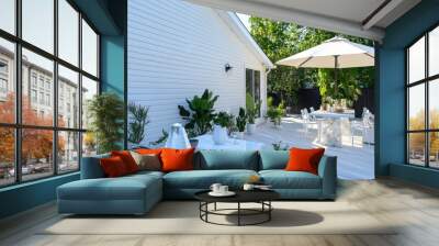 Quartz house with white vinyl siding, a mineral-inspired patio with a quartz dining table, crystal grill, opal umbrella, and white potted plants Wall mural