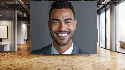 Smiling professional young man wearing suit and tie headshot portrait on grey background Wall mural