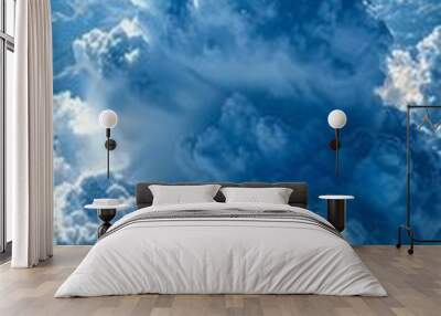 b'Large white and blue cloudscape with bright light shining through the clouds' Wall mural