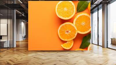 Fresh Orange Slices and Leaves on Orange Background Wall mural