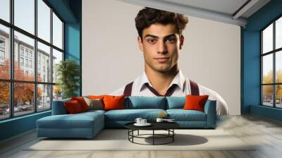 Portrait of a handsome young man with dark hair and brown eyes wearing a white shirt and tie Wall mural