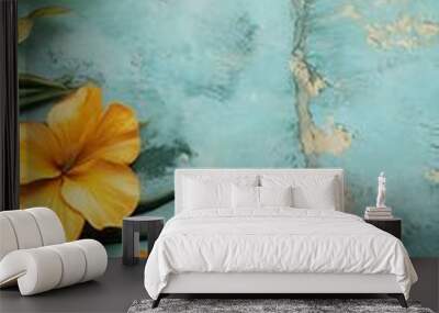 Tropical Flowers and Palm Leaves on a Teal Background Wall mural