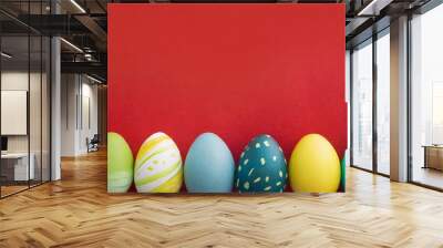 Colorful Easter Egg bottom border over a red banner background. Copy space.  Wall mural