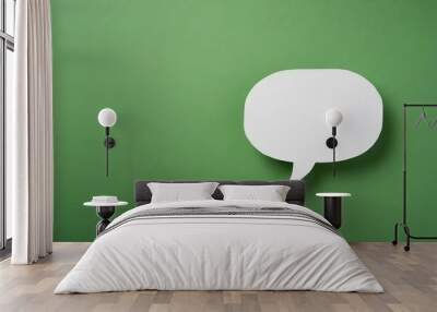 white paper cut out speech bubble shape set on green paper background. Wall mural