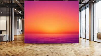 A beautiful sunset over the ocean with a pink and purple sky Wall mural