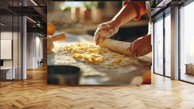 A person is rolling out dough in a kitchen Wall mural