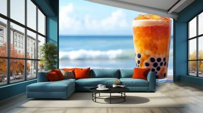 A refreshing glass of Thai bubble tea, filled with amber-colored tea Wall mural