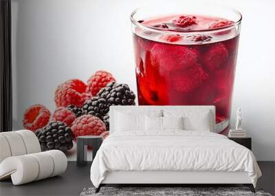 A vibrant red raspberry-blackberry mix drink in a transparent glass on a white background Wall mural