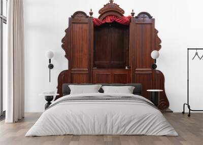 Detail of an old wooden confessional in a Spanish church, in Las Palmas de Gran Canaria on a white background Wall mural