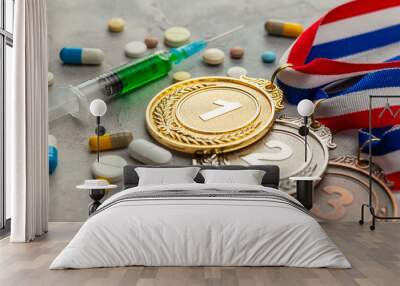 Doping for athletes. Golds, silver and bronze medal and doping syringe and pills with capsules on a gray background Wall mural