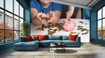 Two children put coins in piggy bank Wall mural