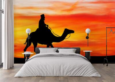 Arab man on camel at sunset Wall mural