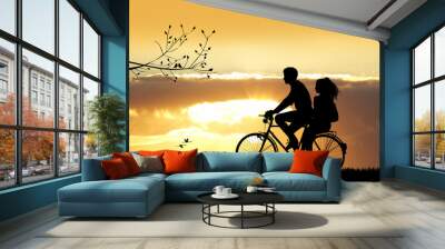 couple on bicycle at sunset Wall mural