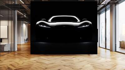 A black car with headlights on in a dark studio. Wall mural