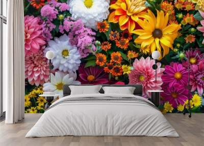 A vibrant bouquet of colorful flowers with green leaves Wall mural