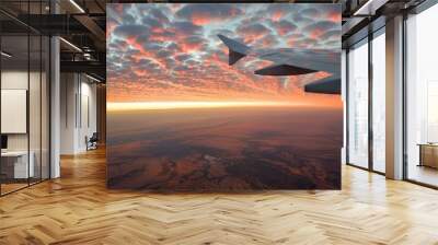 Airplane Wing View of Sunset Clouds and Landscape Wall mural