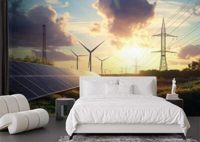 Solar panels, wind turbines, and power lines in a field at sunset. Wall mural