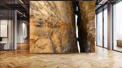 insight into a crevice of sandsone rocks abstract orange colored stone texture Wall mural