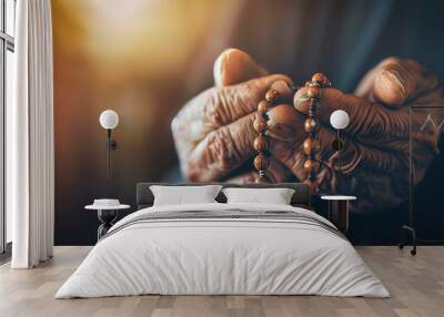 The hands of an old catholic monk praying, holding a rosary Wall mural