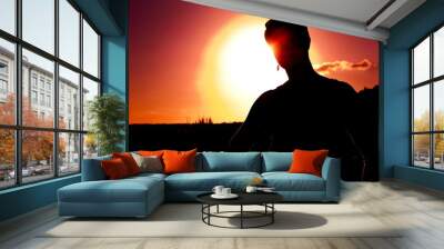 Silhouette at sunset Wall mural