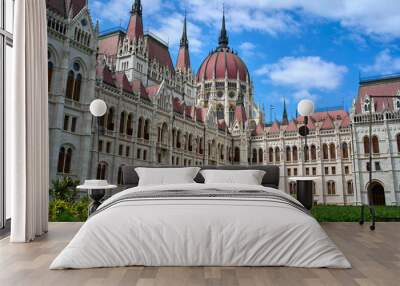 Hungarian Parliament Building on a summer day with green bushes in foreground in central Budapest, Hungary. Wall mural