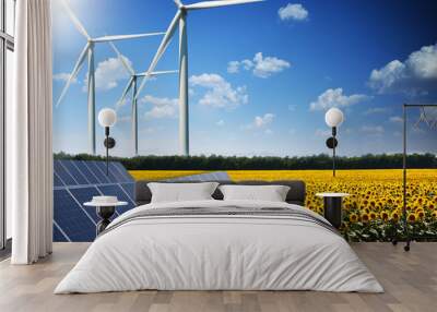 Green energy concept with solar panels and wind turbines on a sunflower field Wall mural