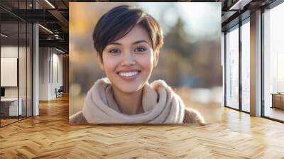 Backlit image of a Smiling charming southeaster  Asian young brunette posing at a beautiful park looking at the camera Wall mural