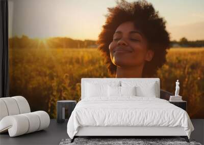 Backlit Portrait of calm happy smiling free black woman with closed eyes enjoys a beautiful moment life on the fields at sunset	
 Wall mural