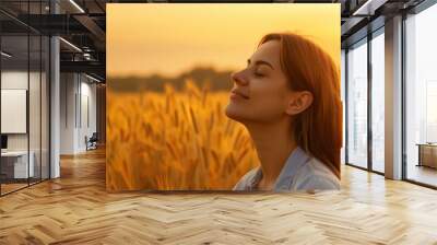 Backlit Portrait of calm happy smiling free woman with closed eyes enjoys a beautiful moment life on the fields at sunset	 Wall mural