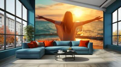 Backlit Portrait of calm happy smiling free woman with open arms and closed eyes enjoys a beautiful moment life on the seashore at sunset	 Wall mural