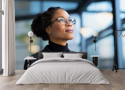 Black female corporate manager looking away with optimism thinking in future investments Wall mural