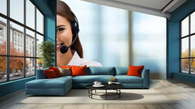 Call center, young woman and smile in contact us with CRM, headset with mic and mockup space. Customer service, happy female and telemarketing with sales and help desk.  copy space Wall mural