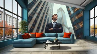 Confident  wealthy rich successful business man standing in big city modern skyscrapers street on sunset thinking of successful future vision, dreaming of new investment opportunities Wall mural