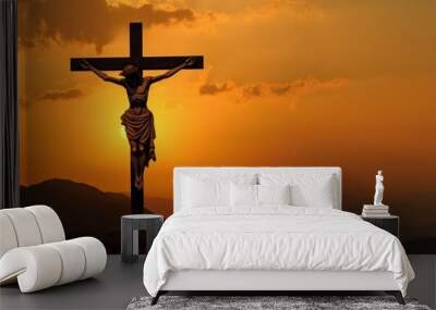 Cross on the top of the mountain with sunset background Wall mural