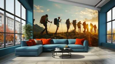 Group tourists of hiker sporty people walks in mountains at sunset with backpacks. Concept adventure  Wall mural