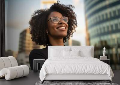 Happy wealthy rich successful black businesswoman standing in big city modern skyscrapers street on sunset thinking of successful vision, dreaming of new investment opportunities. Generative AI Wall mural