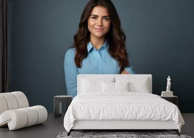 Happy young smiling confident professional business woman wearing blue shirt, pretty stylish female executive looking at camera, standing arms crossed isolated at gray background,  Wall mural