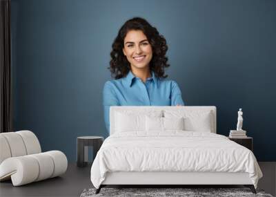 Happy young smiling confident professional business woman wearing blue shirt, pretty stylish female executive looking at camera, standing arms crossed isolated at gray background,  Wall mural