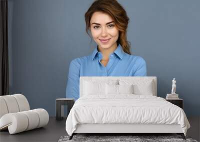 Happy young smiling confident professional business woman wearing blue shirt, pretty stylish female executive looking at camera, standing arms crossed isolated at gray background, Generative AI Wall mural