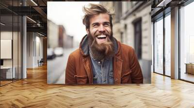 Laughing young man wearing a long hipster beard looking at the camera. Generative AI Wall mural