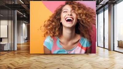 Laughing young woman on a colorful background Wall mural