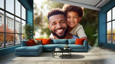 Portrait, happy father and boy smile in garden fun, vacation and break in summer happiness together. Black man and child smile, love and hug outdoor bonding free time on a sunny day in the park Wall mural