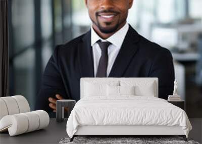 Smiling black executive posing with his arms crossed at the office looking at the camera Wall mural